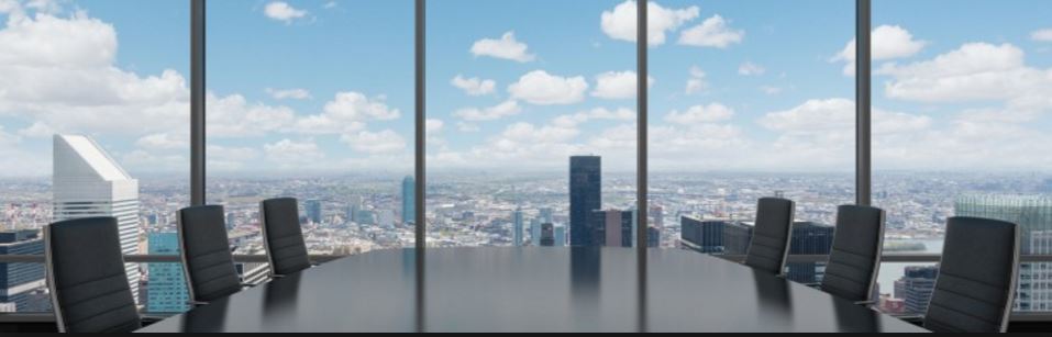 Image of an office boardroom with view of the city.